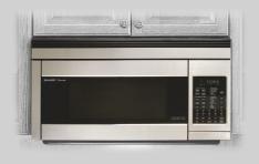 OVER THE RANGE MICROWAVE OVENS R-1514 The look of the R-1514 Microwave is clean, uncluttered and symmetrical. Sharp has dis screetly concealed the Control Pa nel behind the oven s door.