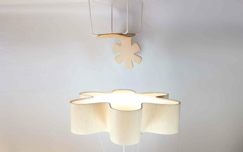 Giant Lotus Pendant Introducing the Giant Lotus Pendant A serene, luminous and shapely pendant in sophisticated wood veneer, inspired by the blossoming flowers of Lampa s own East End cutting garden.