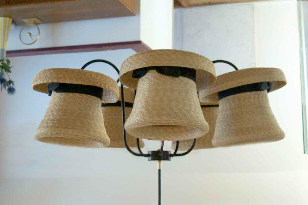 Hat Chandelier The Hat Chandelier Our best-selling Hat Chandelier comes in natural straw.