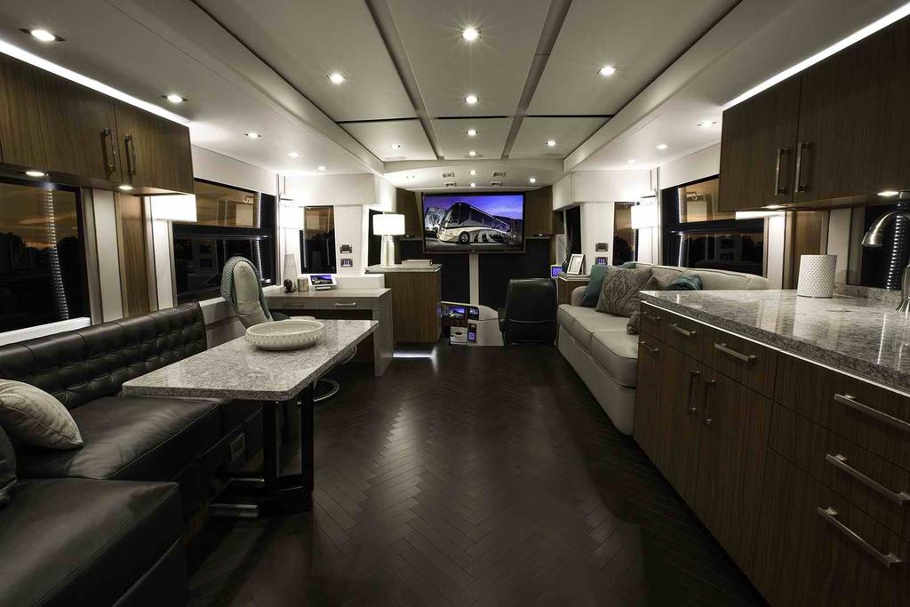 The dual front slide rooms offer a spacious and welcoming living area in the front of the coach.