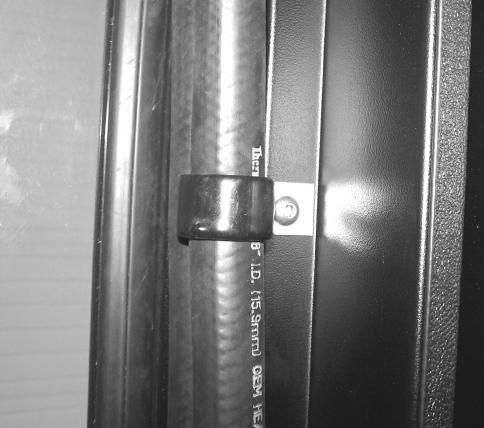 v) Use provided clips to secure heater hose along inside the cab fig.5/fig.6. Run a piece of trim along latch bolt bracket to stop hose from getting damaged fig.