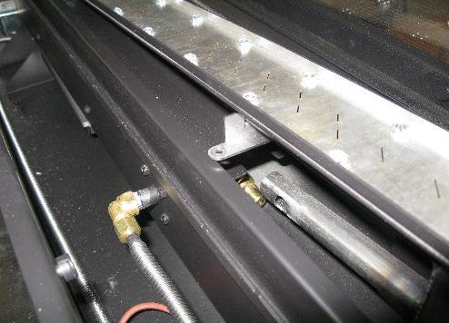 The burner(s) are retained by #10 sheet metal screws, using a 5/16 nut driver, remove these screws. (8 screws in the 48 and 60 inch models; 12 screws in the 72 inch). 2.