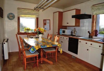 Carrick Cottage is one of a small cluster of houses splendidly situated close to Carrick Shore with views of the bay.