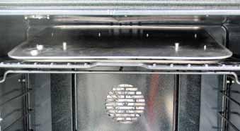 To remove the vent tube/smoke eliminator: Place an oven rack in the top position and remove any remaining oven racks.