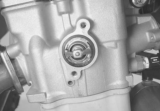 Engine Cooling System: F- Installation ) Apply engine coolant to the rubber seal on the thermostat (). ) Install the thermostat ().