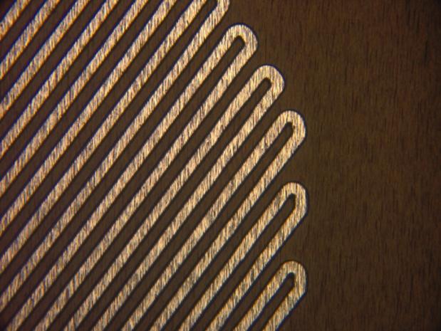 Ultra fine element widths and spacing is possible with etched foil heaters. Shown here are.003 wide elements with.003 spacing.