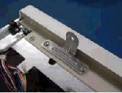 3. Install the two (2) front stacking brackets onto the washer with four (4) screws, provided in the kit.