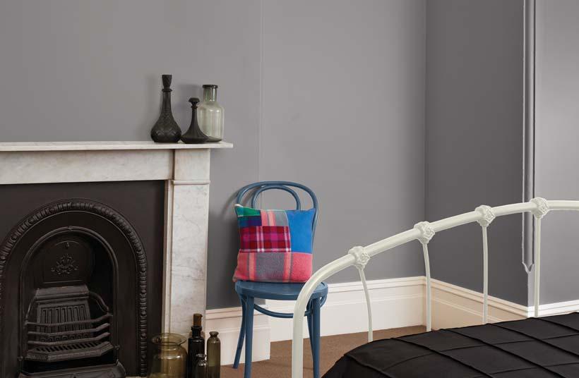 Feature colours like red and blue keep the palette simple and create a youthful feel to the room.