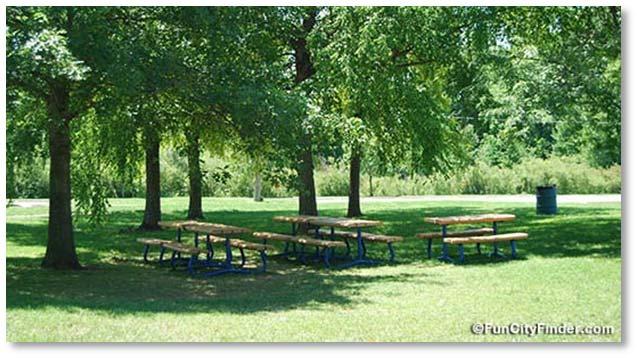 Village of Malone West Street Park ITEM 4. Picnic Tables and Shade Trees Improvement Description Picnic tables are recommended adjacent to the storage facility under a grove of shade trees.