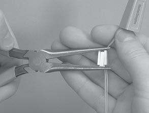Secure the adjustment made by sliding the wedge securely into the equalizer, making sure the rib is against the cords locking them in place.