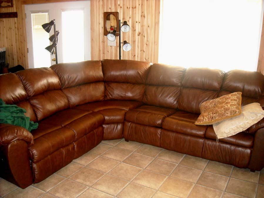The leather sofa has a pull out bed for