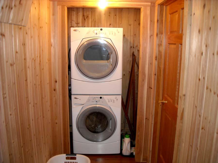 At the end of the upstairs hallway the guest may wash and dry their cloths in a stainless steel