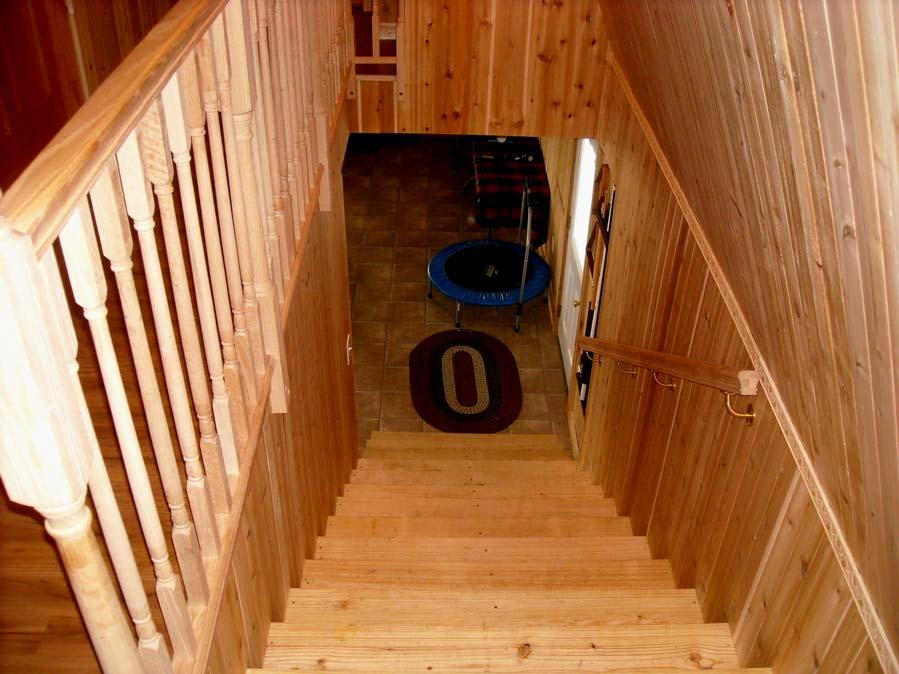 The stair way is extra wide and the entire inside of Barn I is knotty cedar and the banister is Oak.