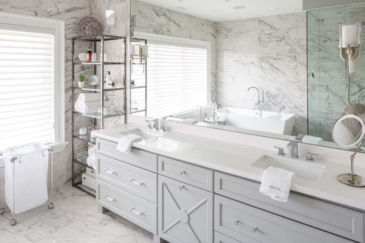 13 The master bath speaks to luxury, particularly the heated Statuario Venato polished porcelain tiles.