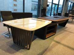 It s made of different size table top with leather board, legs in solid wood, side