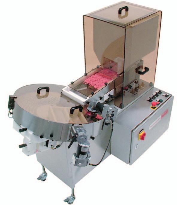The tablets are loaded into the feed hopper which has an adjustable feed gate. The tablets are fed over a perforated plate by a vibratory feeder. The perforated plate has three sections.