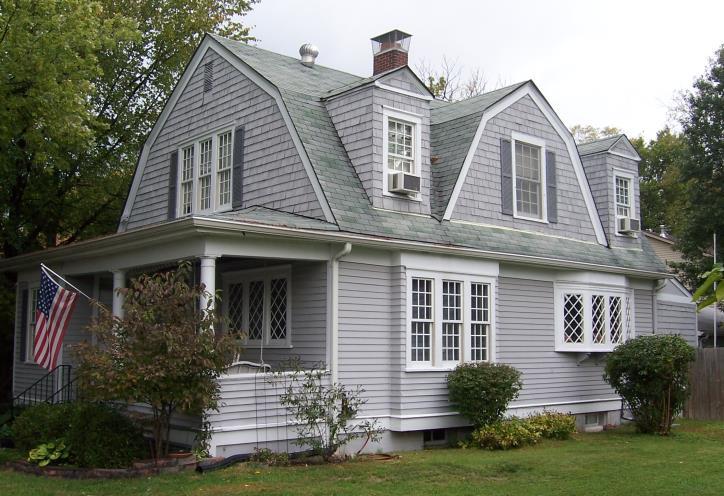 Front entrances featured doors with separately opening upper and lower halves. gambrels or gables; flared eaves; wide overhangs; dormers or one continuous dormer across the front.