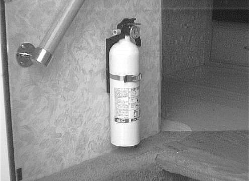 FIRE EXTINGUISHER A dry chemical fire extinguisher is located near the floor by the side entrance door.