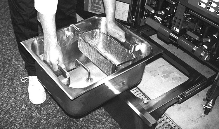 Lift the drawer slides up and off the slide guides (Fig. 18). PL-41619 5. Carry the parts to the sink area for cleaning. 6. Remove the crumb basket from the filter tank. Fig. 16 7.