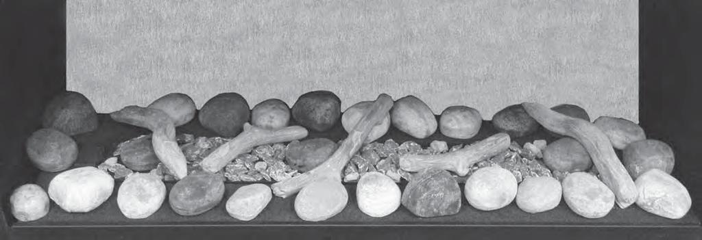 Add the twigs to the rocks placing them as shown. Note: The position of the twigs are specifi c to obtain the best fl ame pattern.