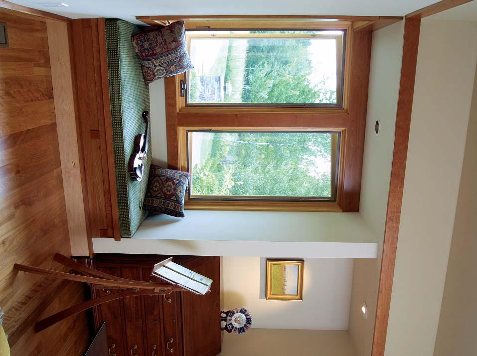SOFFITS CREATE COZY ALCOVES Dropping the ceiling at a window seat or a task-specific area, such as above a dresser or a soaking tub, can create a comfortable nook.