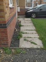 paving stones and grass going between the