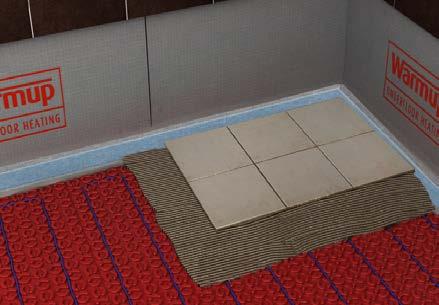 Tiled Floors 1 2 Cover the installation with a full bed of modified thinset using a flat trowel. Take care not to damage or dislodge the heating cable.