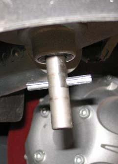 Reach into the center of the brush and remove the cotter pin holding the brush and the retaining washer to the hub. 5.