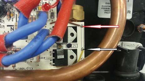 With no water flowing through the unit, check continuity between the brown wire and the yellow wire on the circuit board using 100 ohms scale (see Fig. 5).