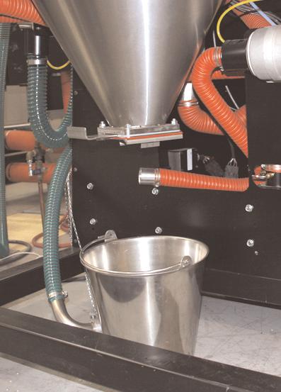 Grasp the spreader cone tube, lift up slightly, twist and then push down to release it. Tilt the cone assembly and pull it out through the hopper door.