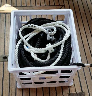 Turn on the WINDLASS BREAKER and as the boat moves toward the anchor, press the up control to take up slack line. As the rode comes in use the deck hose to wash off mud and seaweed.