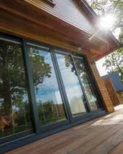 KAWNEER ALUMINIUM INLINE SLIDING PATIO DOORS TWIN TRACK Kawneer Aluminium Patio Doors are perfect for huge glazing spaces with each panel up to 3m wide.