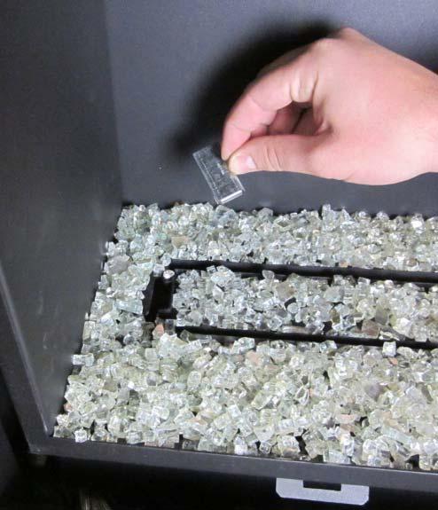 Install the crushed glass on the glass tray following the directions below.