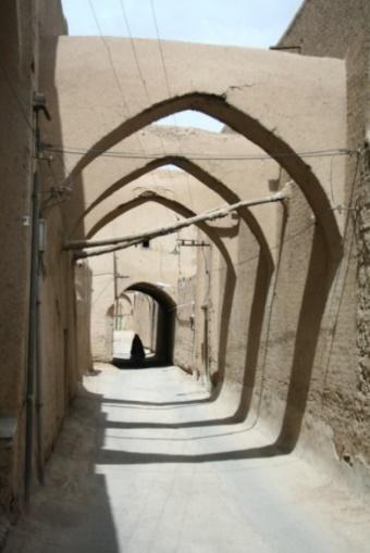 Figure 1. A street in yazd city: Narrow streets with tall walls are used to make more shaded spaces. Morover some part of the street has been covered to increase these shaded spaces 2.