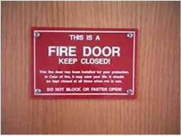 What About NFPA 80 and Signs? 4.1.4.2 Means of Attachment. 4.1.4.2.1 Signs shall be attached to fire doors by use of an adhesive. 4.1.4.2.2 Mechanical attachments such as screws or nails shall not be permitted.