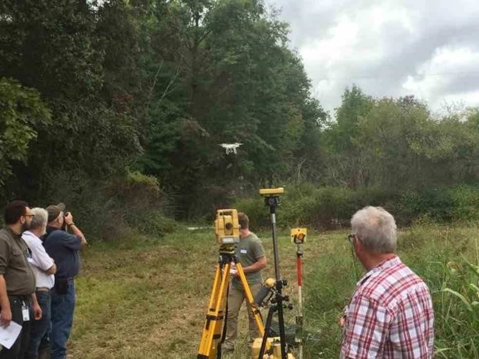 Dan Michael, Consulting Soil Scientist, demonstrating the use of a drone and survey equipment.