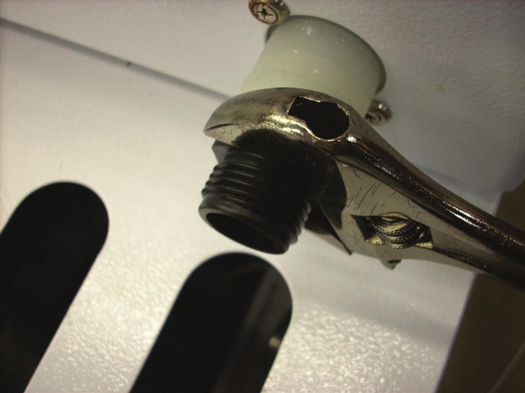 2. Screw the drain coupler into the drain outlet. Tighten with open ended wrench. Figure 4 Figure 5 3.