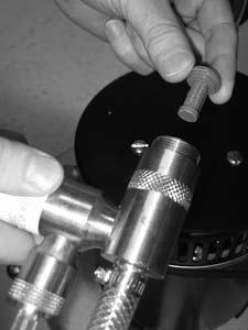 Remove the injector assembly from clamps.