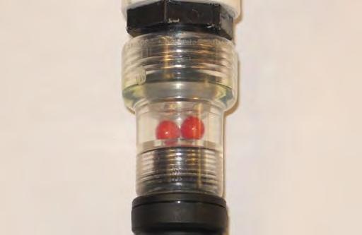 MAINTENANCE 5. Turn on the water supply. The red balls inside the flow indicator will spin. The red balls stop spinning when the batteries are full. 6.