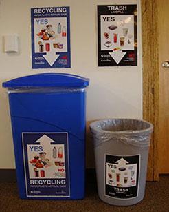 Recycling bins DO NOT have to be blue plastic. They are nice, but any bin will do as long as it has an appropriate sign and a clear or gray bag (i.e. no black trash bags).