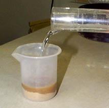 In another cup or beaker, mix 40 g of dried and sieved soil with 40 ml of distilled water (or other amount in a 1:1 soil to water ratio) using