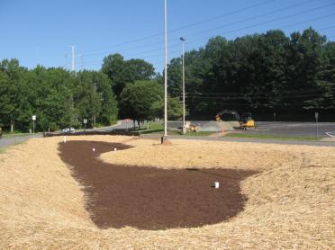 Step 10. Place the surface cover (double shredded mulch, river stone or turf), depending on the design.