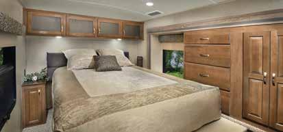 The spacious 37FLK bedroom has opposing slides, a large window, a washer/dryer closet with a louvered