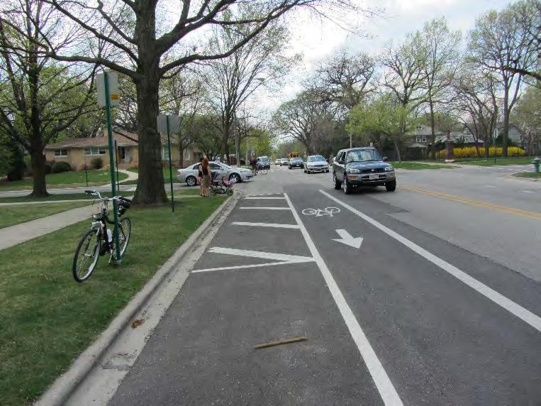 Bicycle network improvements are recommended based on the need for separation from vehicle traffic, existing signal locations to cross major roadways, and alignment with desirable community