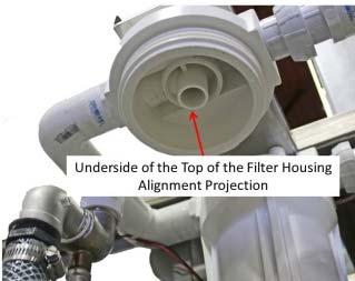 6. Bring the lower filter housing, with the filter installed, up to the underside of the top of the filter housing on the