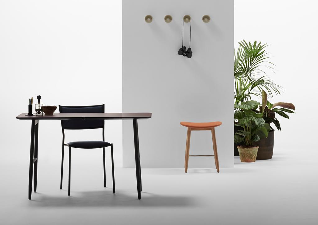 The Icha Icha Stool s graceful wooden construction has now been adapted to a desk.