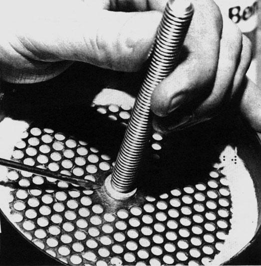 Install the bolt with the oil separator into the bottom of the shell and through center hole of the perforated plate in the bottom of the shell. (See Figure 10) 7.