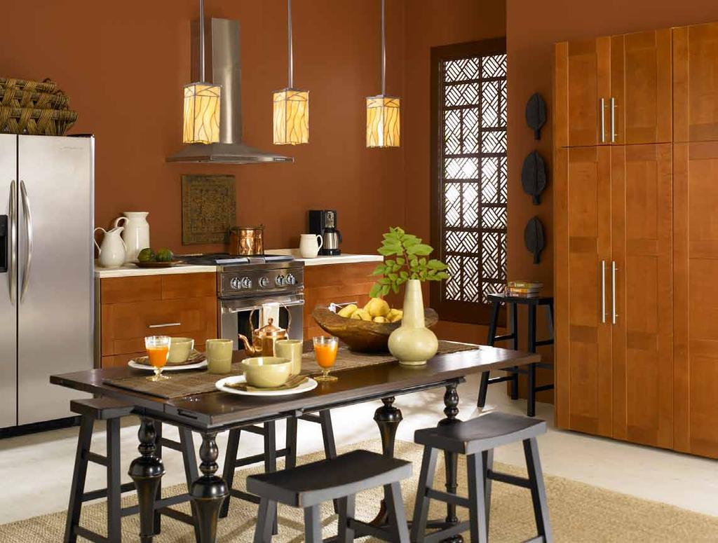 Meanwhile, stainless steel appliances, copper accessories and ebony-stained furniture contrast with the wall color to ensure that the room maintains its contemporary edge.