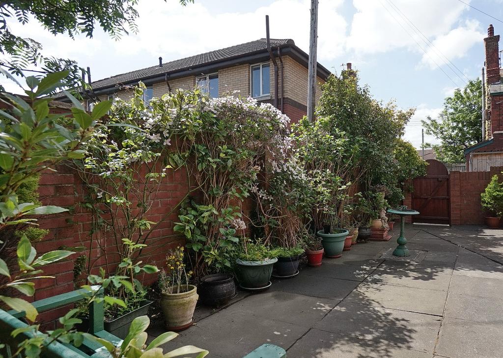 Easily managed patio garden Outside ATTACHED GARAGE: Double timber doors, light and power,