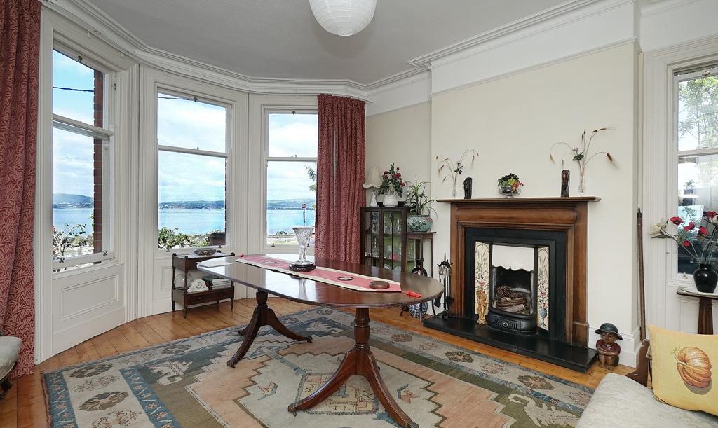 The Agent s perspective: This is a handsome Edwardian townhouse which stands proudly on the shore front and enjoys magnificent views across Belfast Lough towards Carrickfergus.